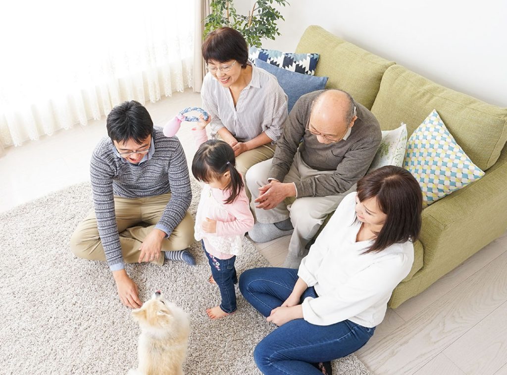 family seating on a sofa